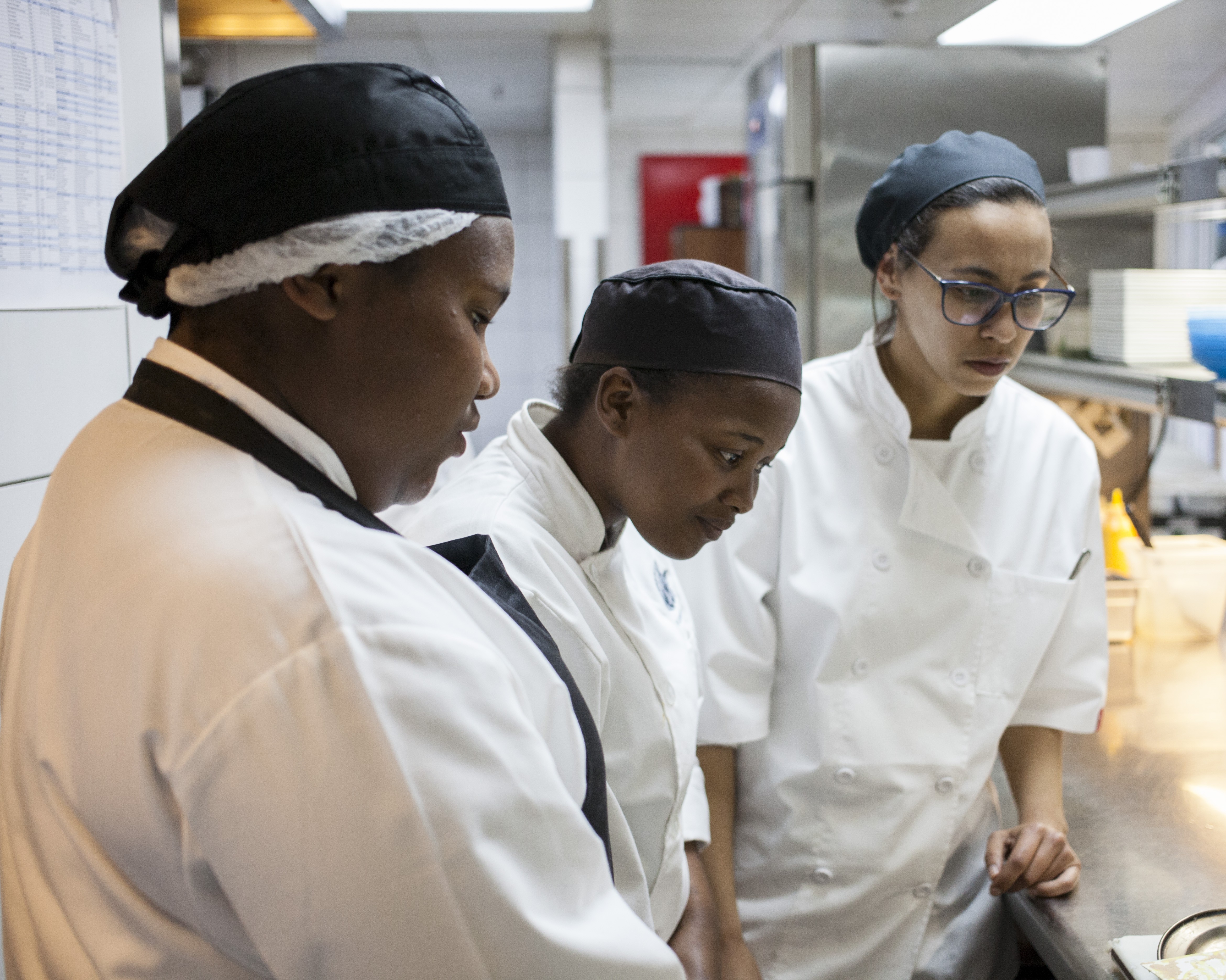 A woman speaking with a group of people